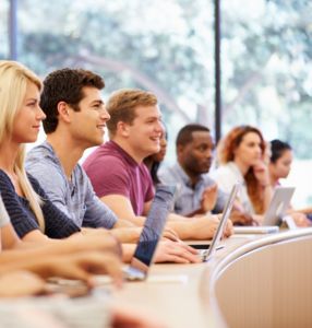 Class Of University Students Using Laptops In Lecture